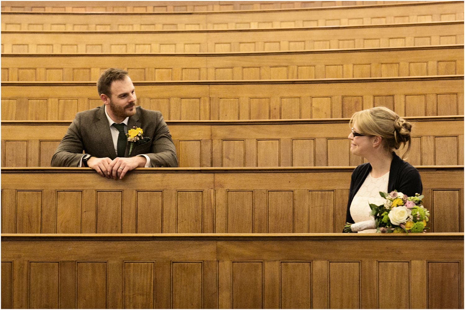 bride and groom in UCL lecture room