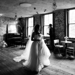Truly candid shot of bride and groom at Wilton’s Music Hall W