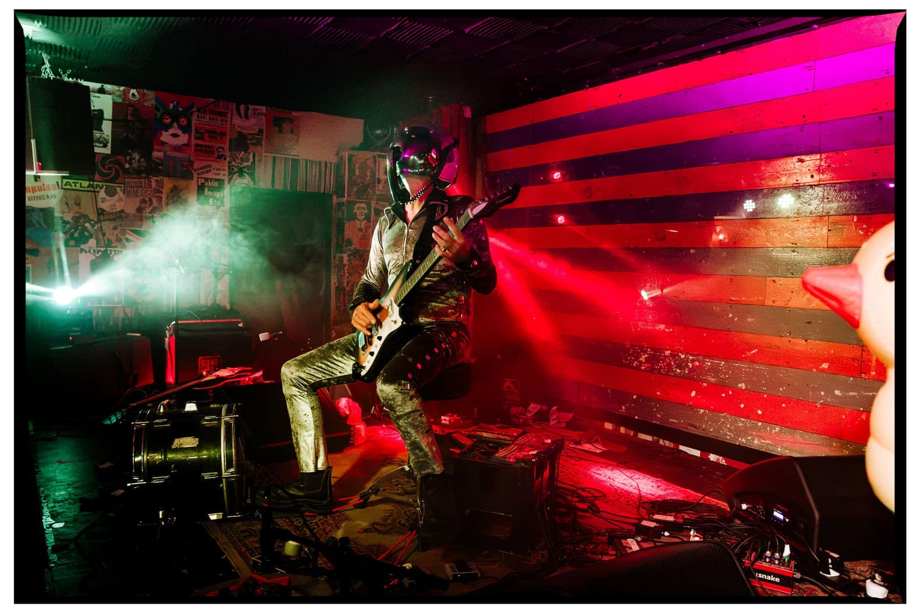 Bob Log III performing with guitar and inflatable duck at The Piper, St Leonards-on-Sea