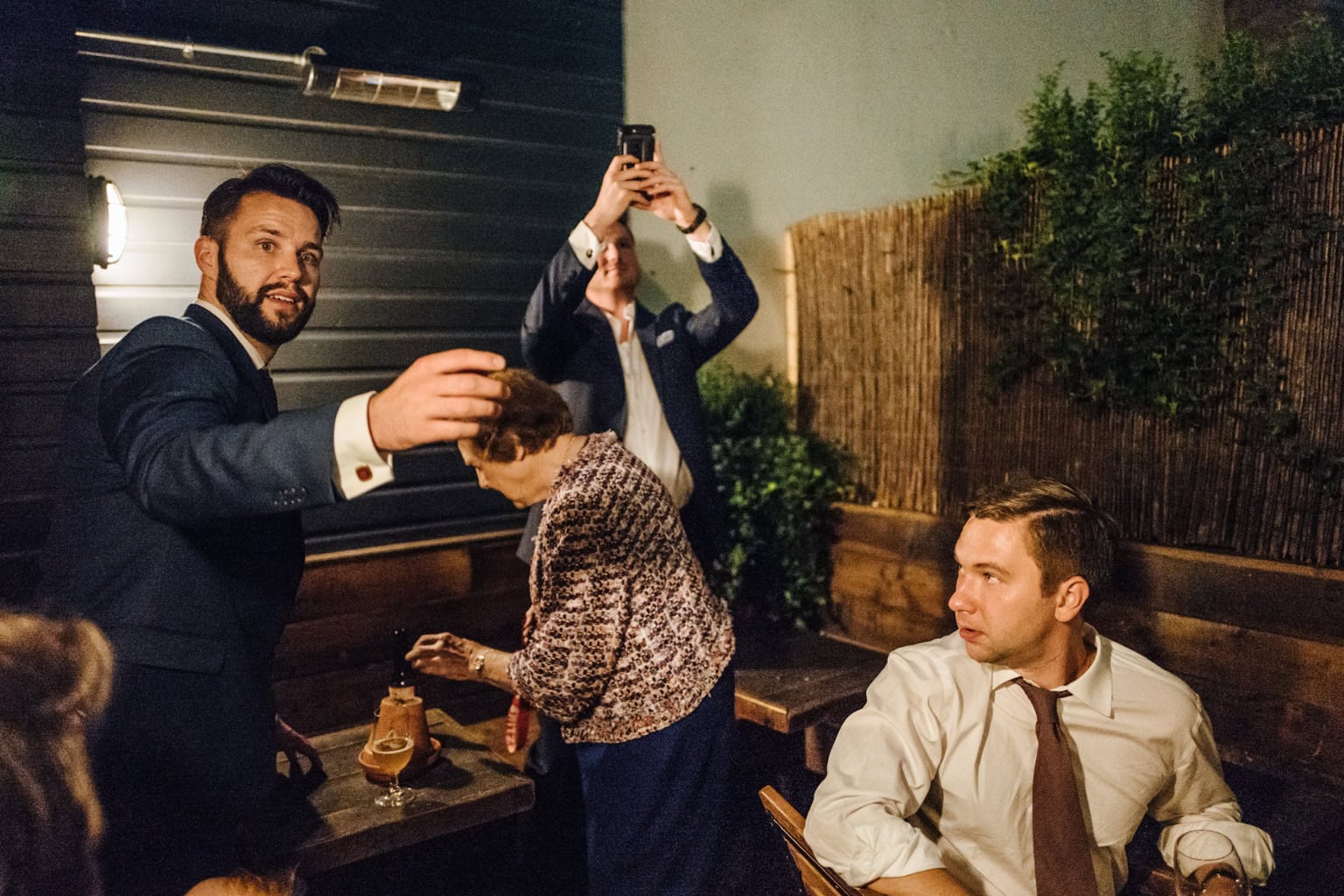 Guests raise drinks in a restaurant