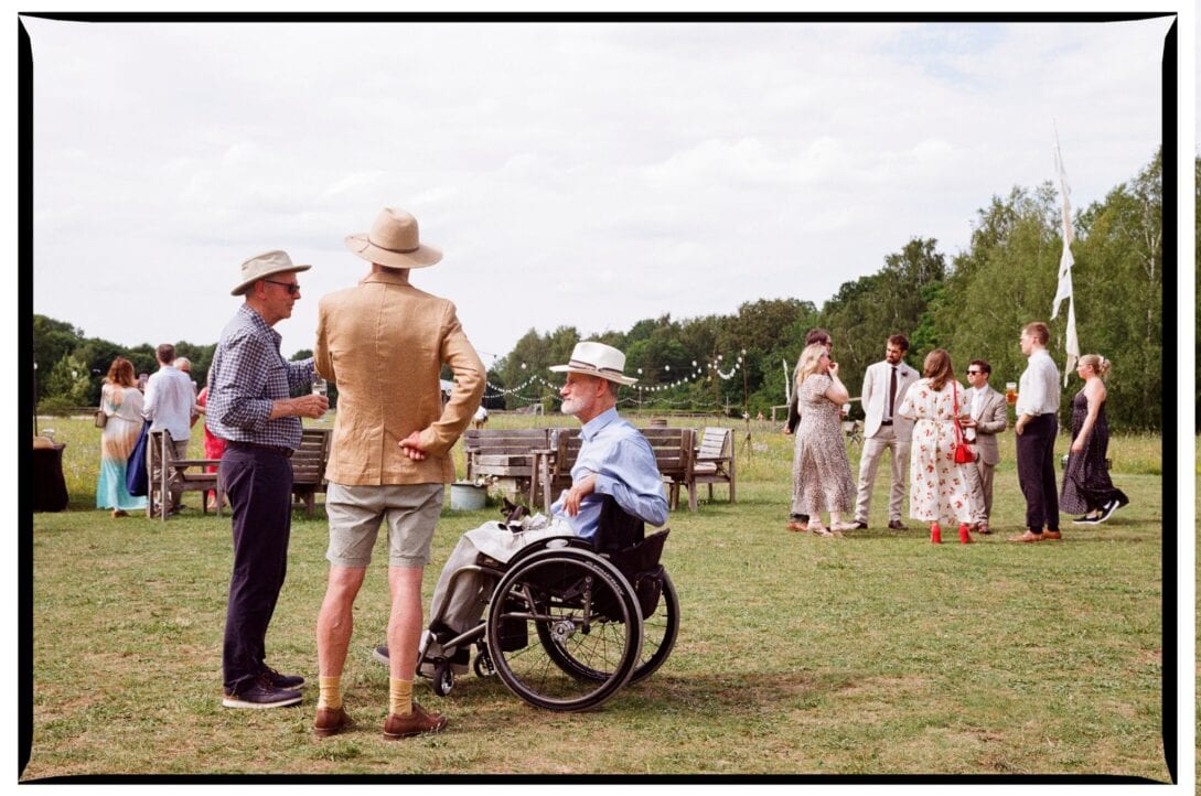 Wedding guests talking on the lawn at Wellington Wood