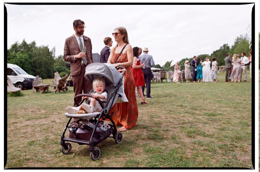 Oliver and Zoe walking beside a child in a pushchair