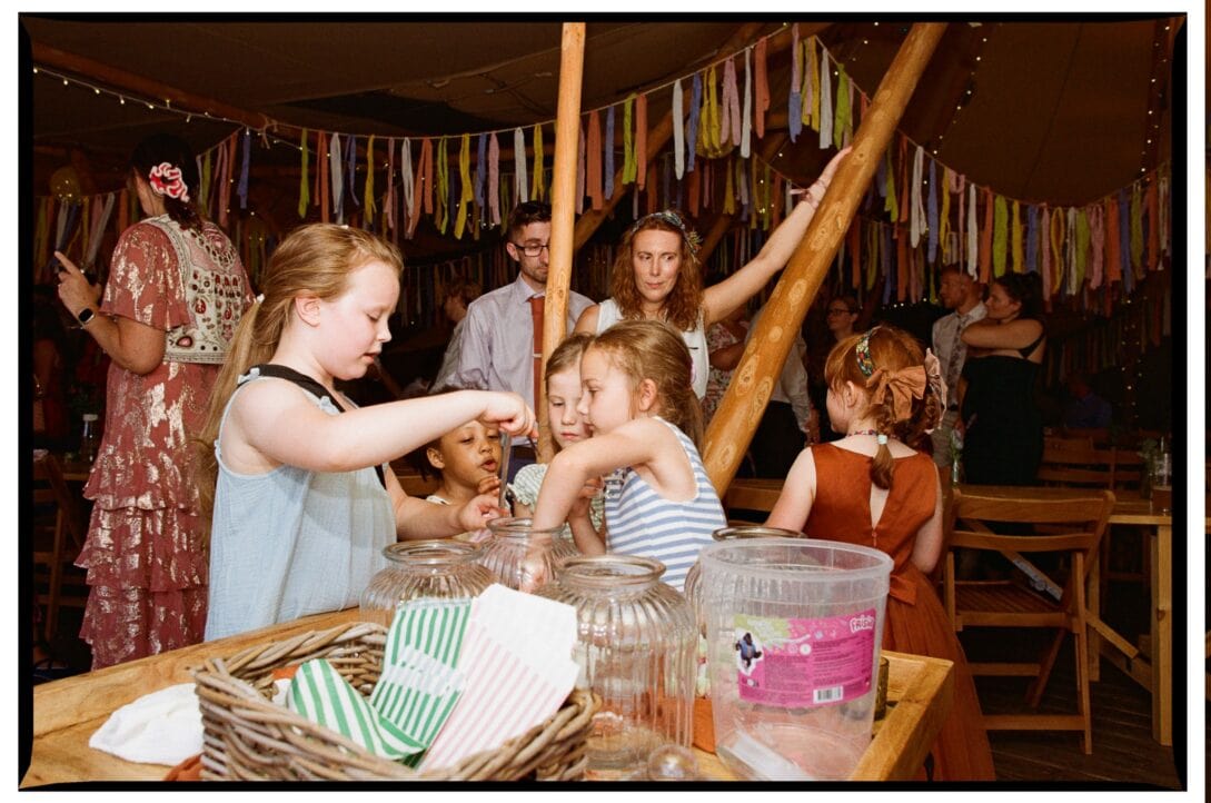 Children at the drinks table in the reception tent
