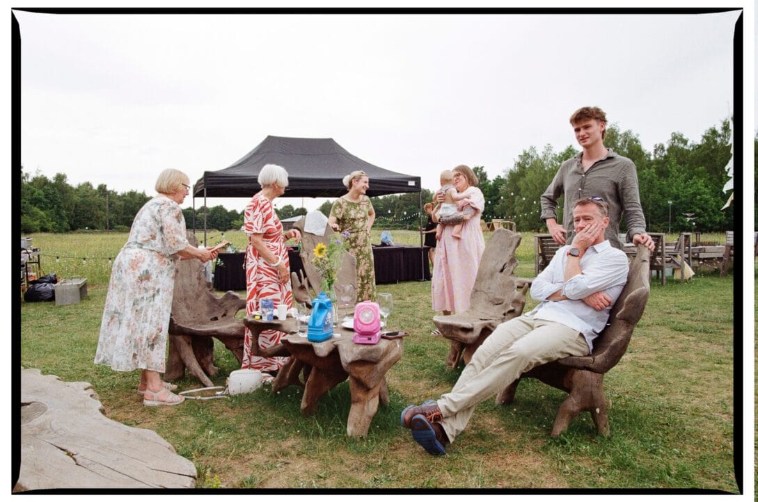 Guests relaxing around a carved wooden table