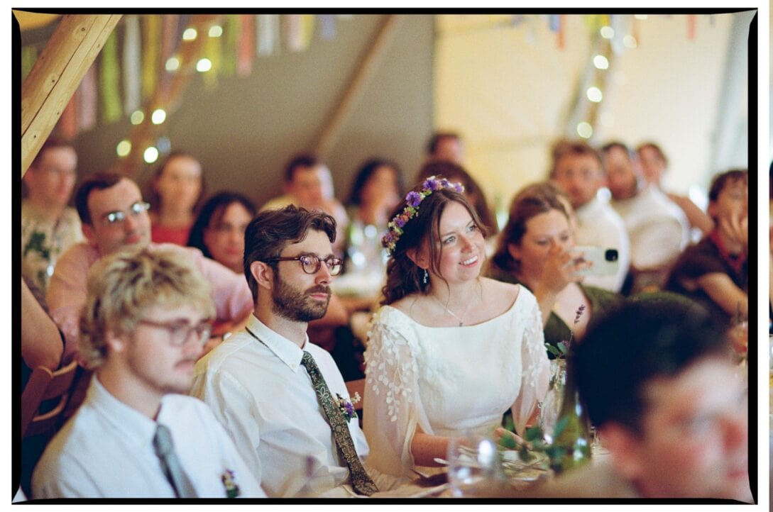Oliver and Zoe listening to speeches in the reception tent