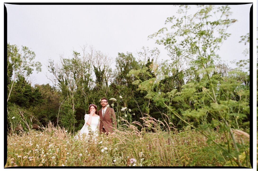 Oliver and Zoe walking through the wild meadow