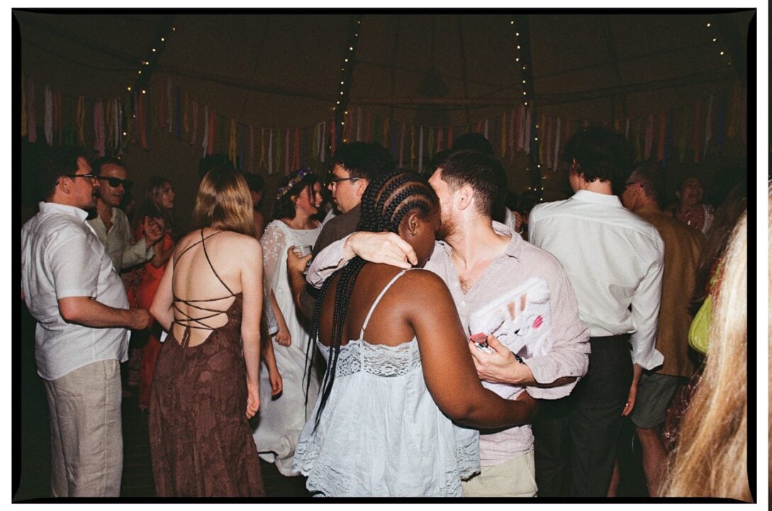 Wedding guests dancing at the evening reception