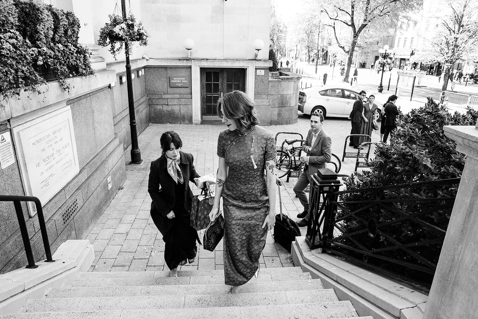 Guests climb the steps of Islington Town Hall before the ceremony
