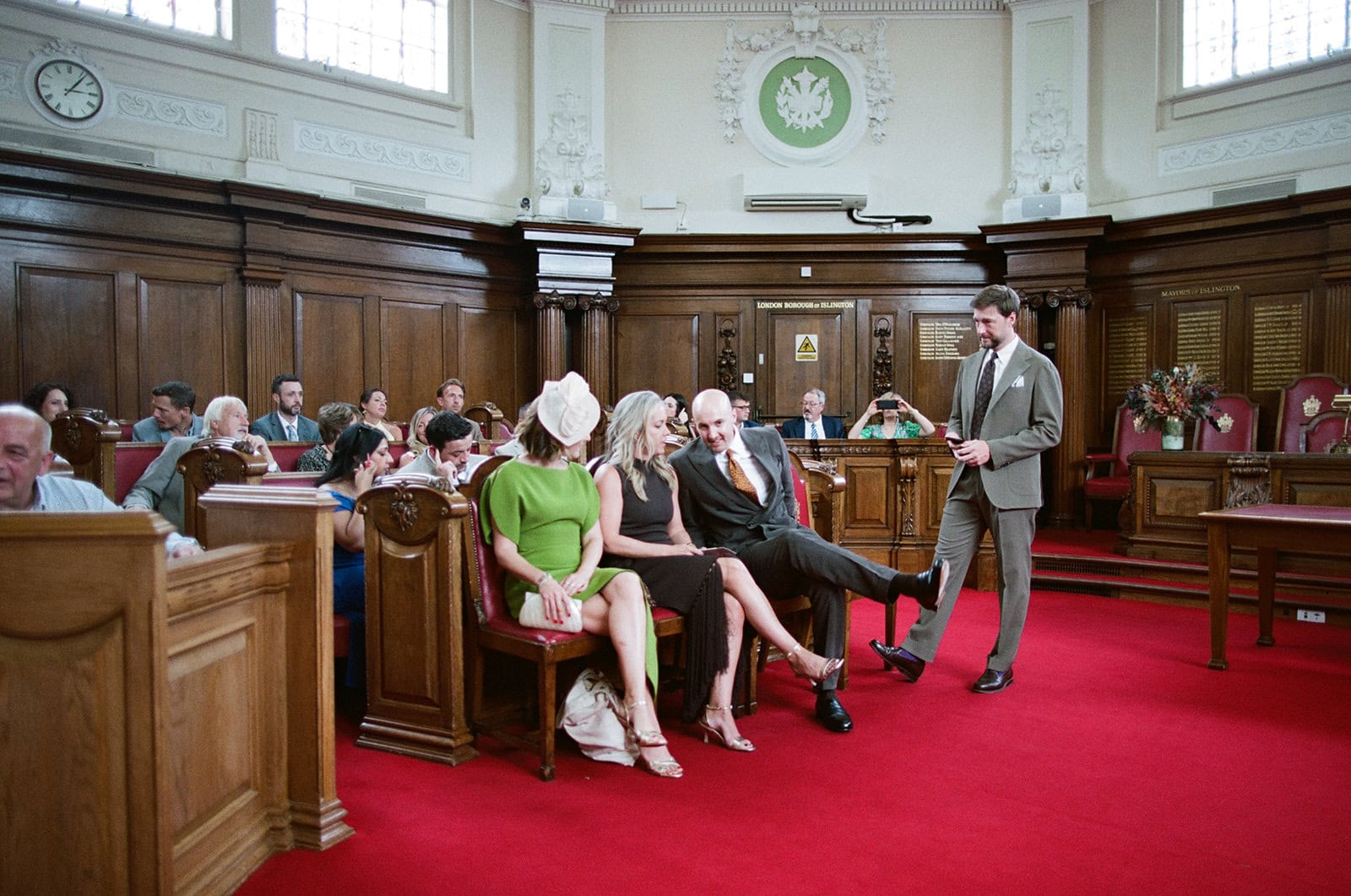 Peter stands before the ceremony in the Council Chamber, photographed on film