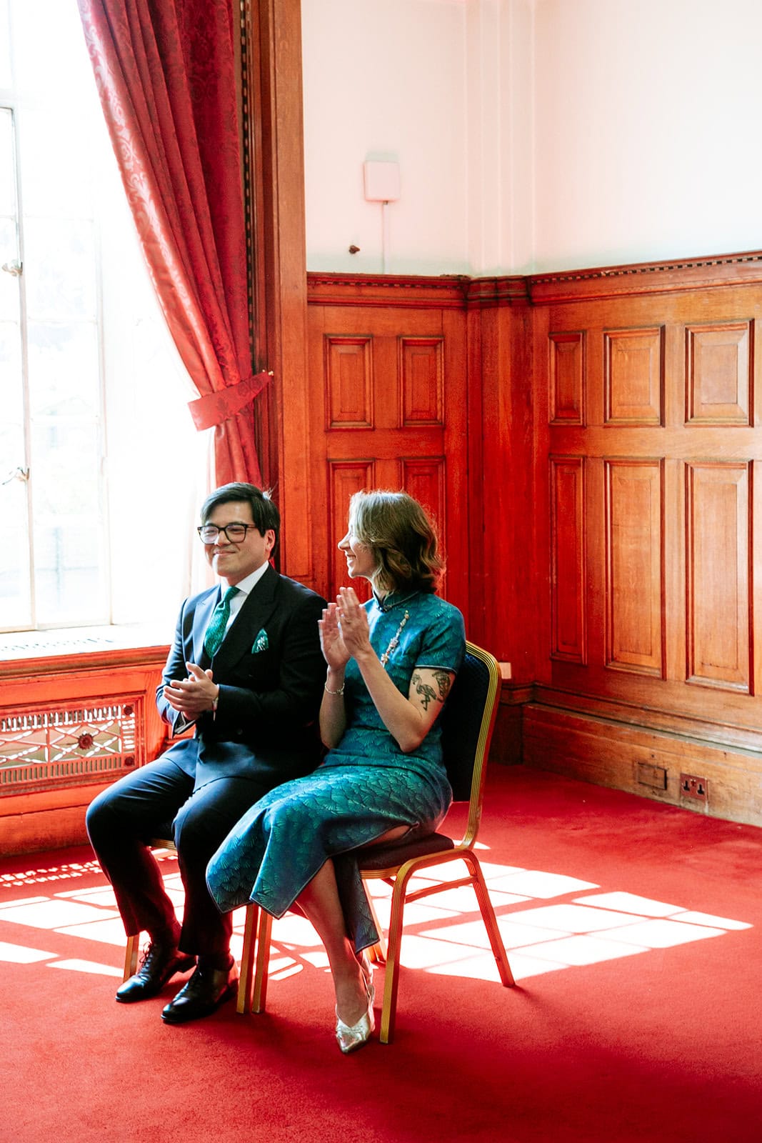 Ruby and Zee seated beside the Richmond Suite’s windows