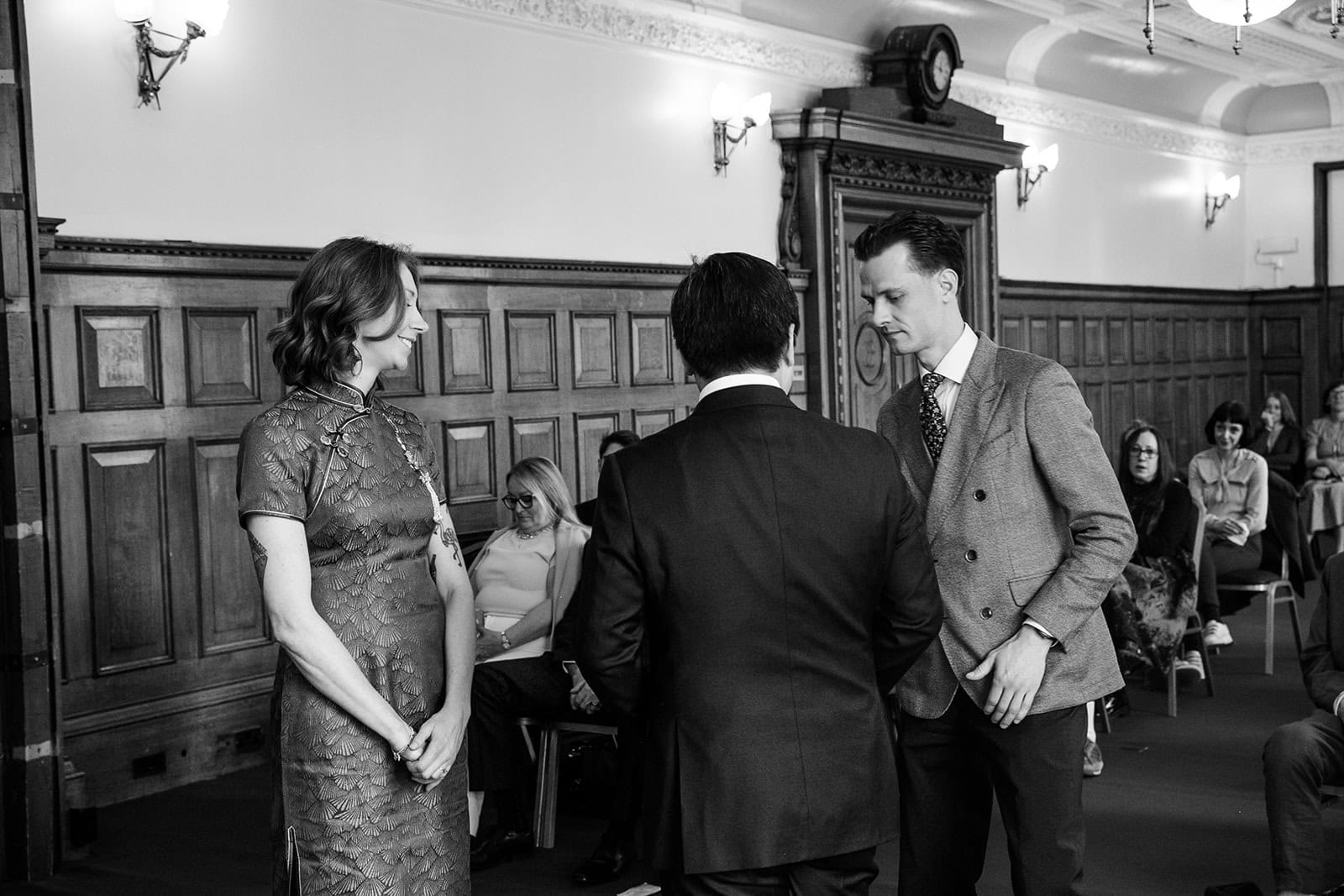 Ruby and Zee stand during their Richmond Suite ceremony