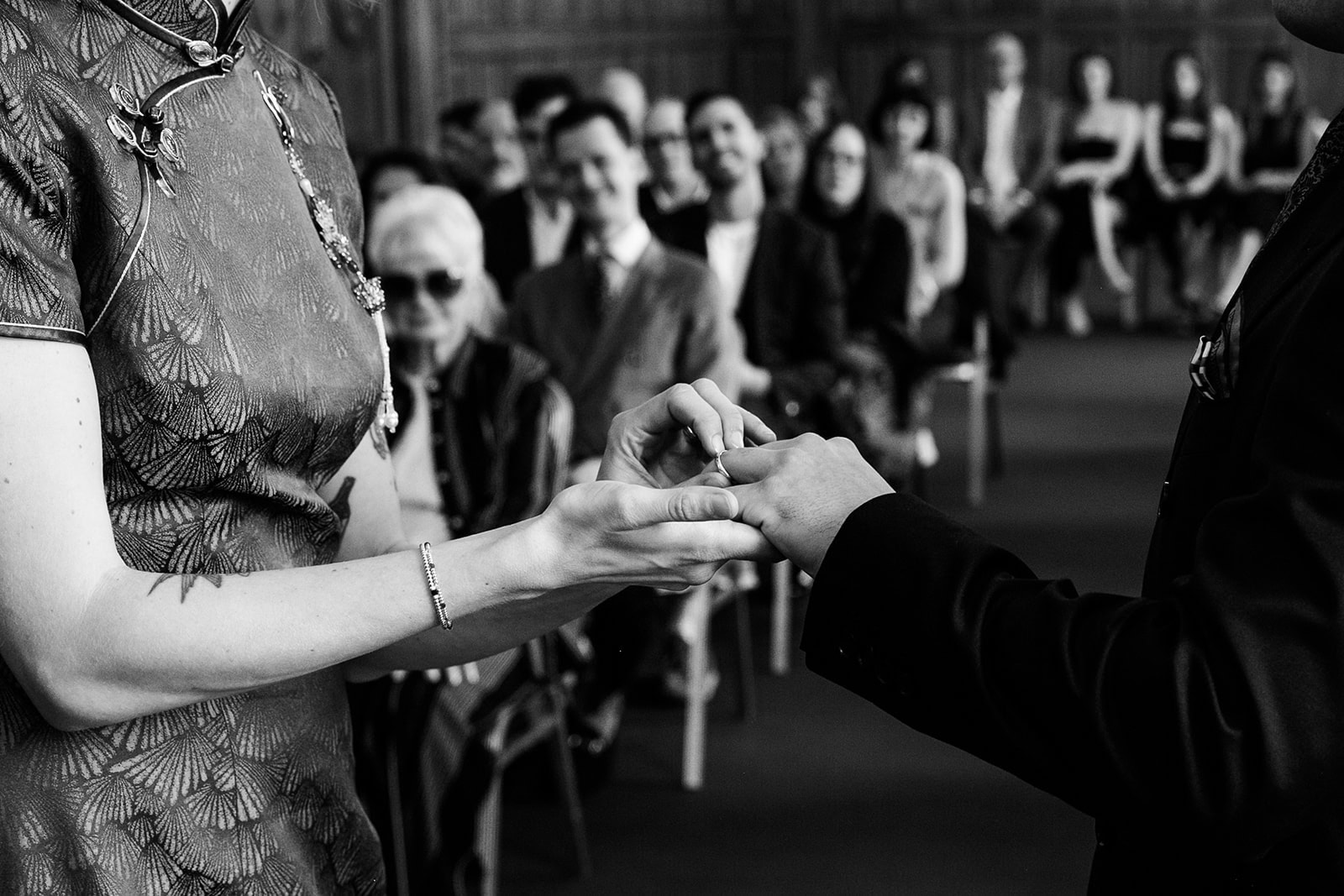 Hands during the exchange of wedding rings