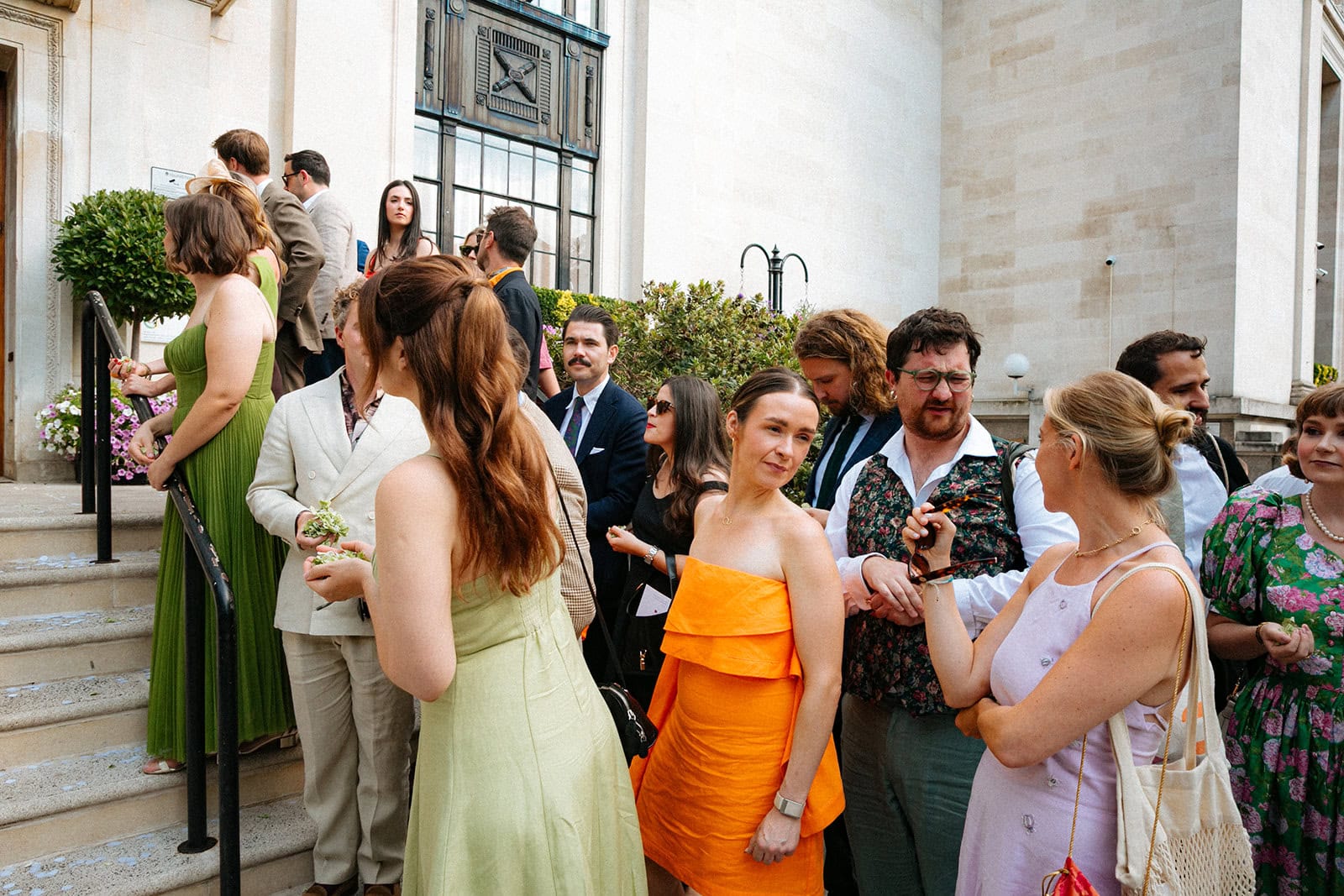 Guests wait with confetti on Islington Town Hall’s steps after the ceremony