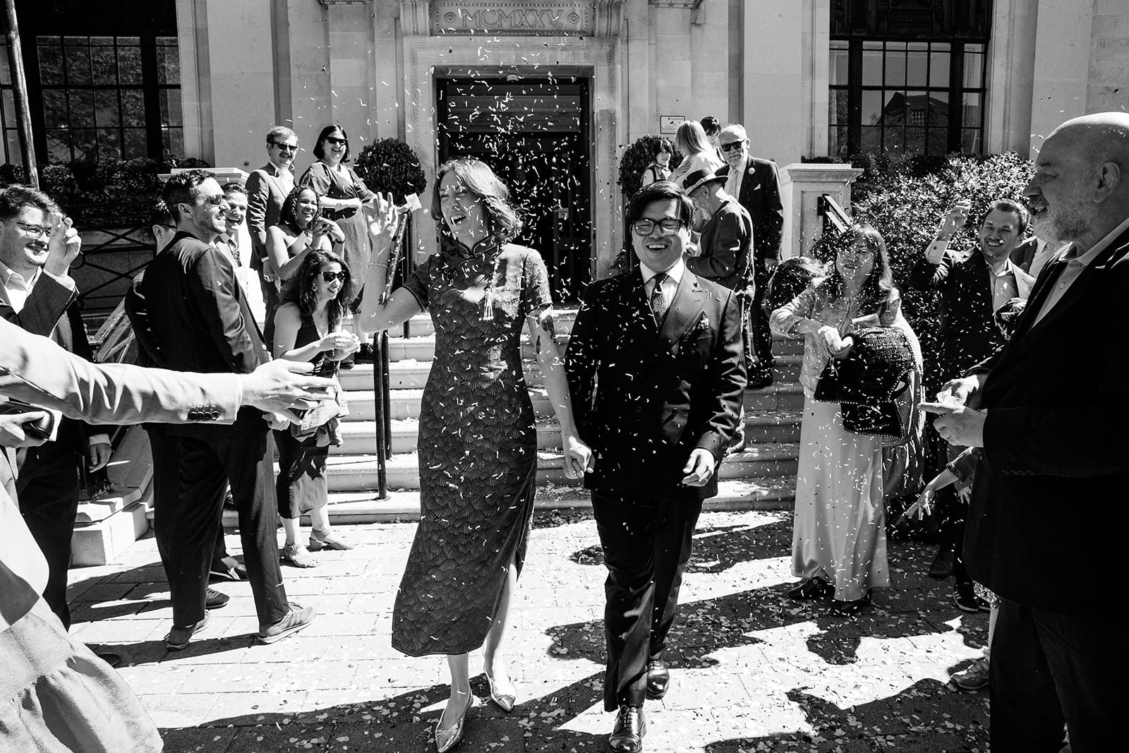 Ruby and Zee leave Islington Town Hall through confetti