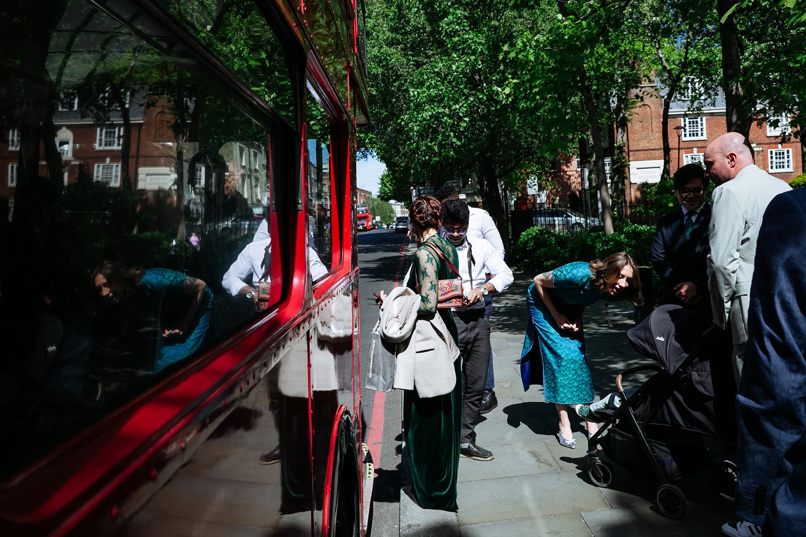 Wedding guests board a Routemaster after the Richmond Suite ceremony