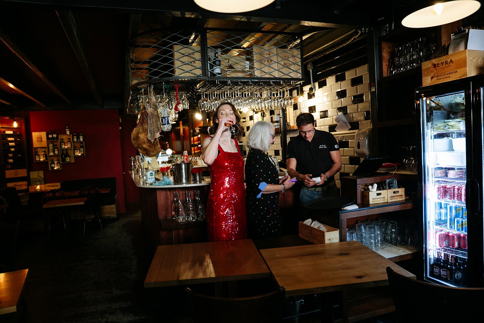 Ruby in a red sequinned dress at the bar at Pedro’s Wine Bar