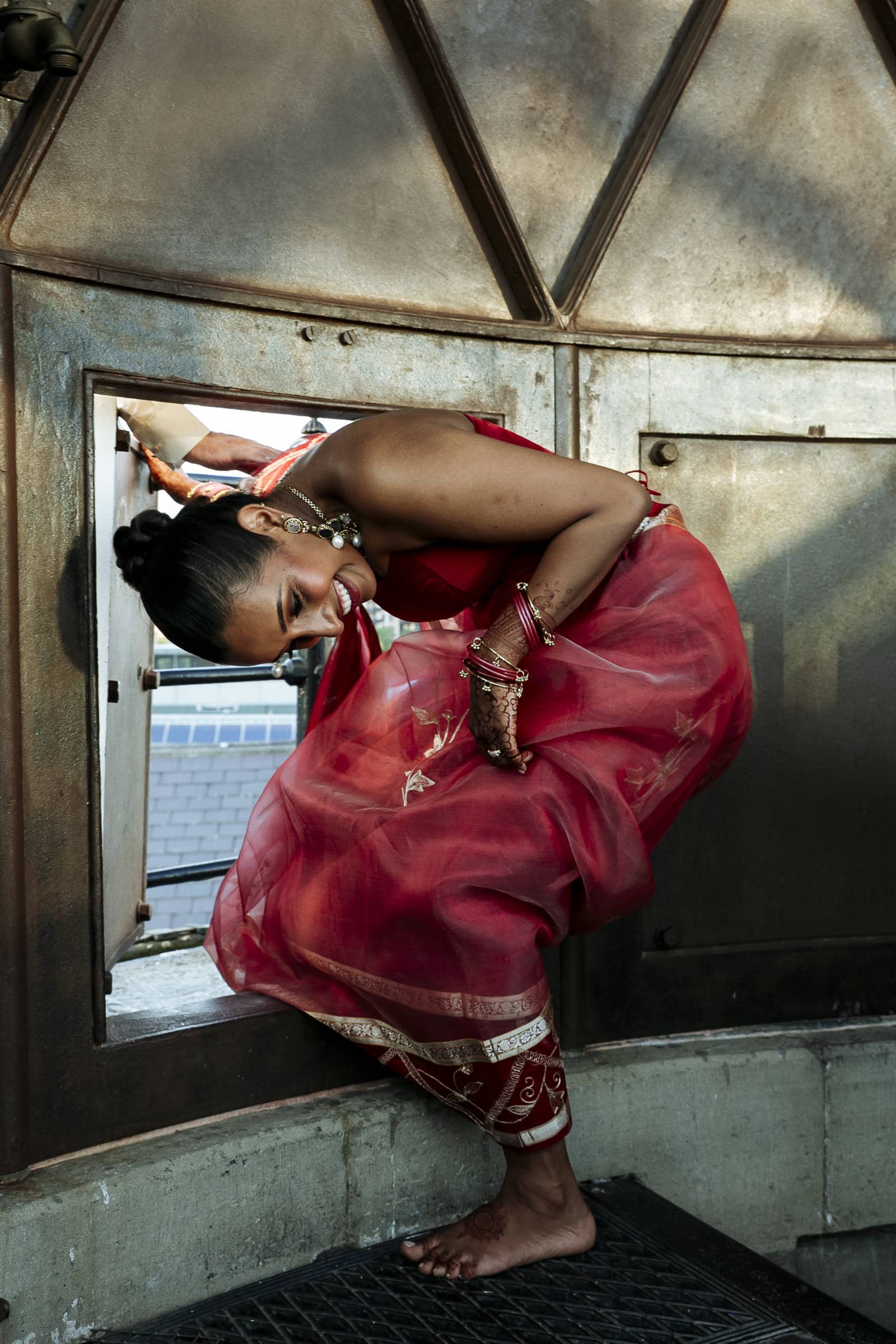 Fayjel laughing as she ducks through the small lighthouse doorway