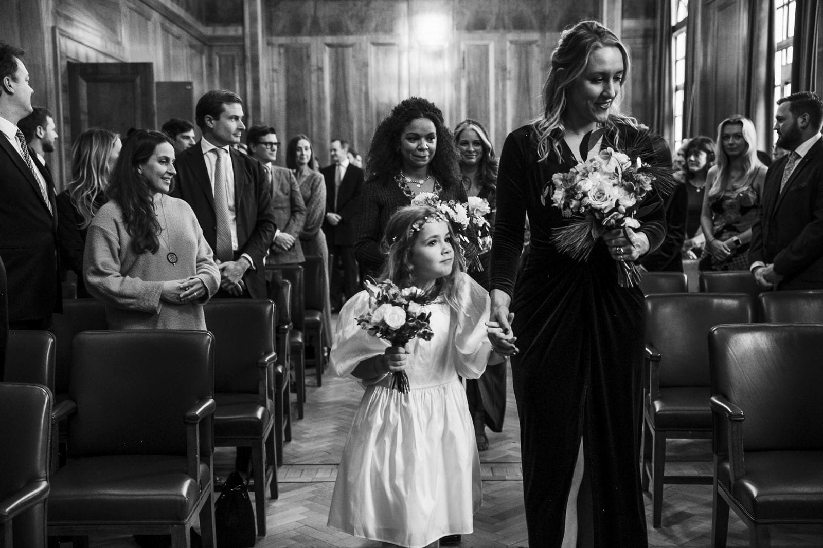 The wedding party entering the ceremony room