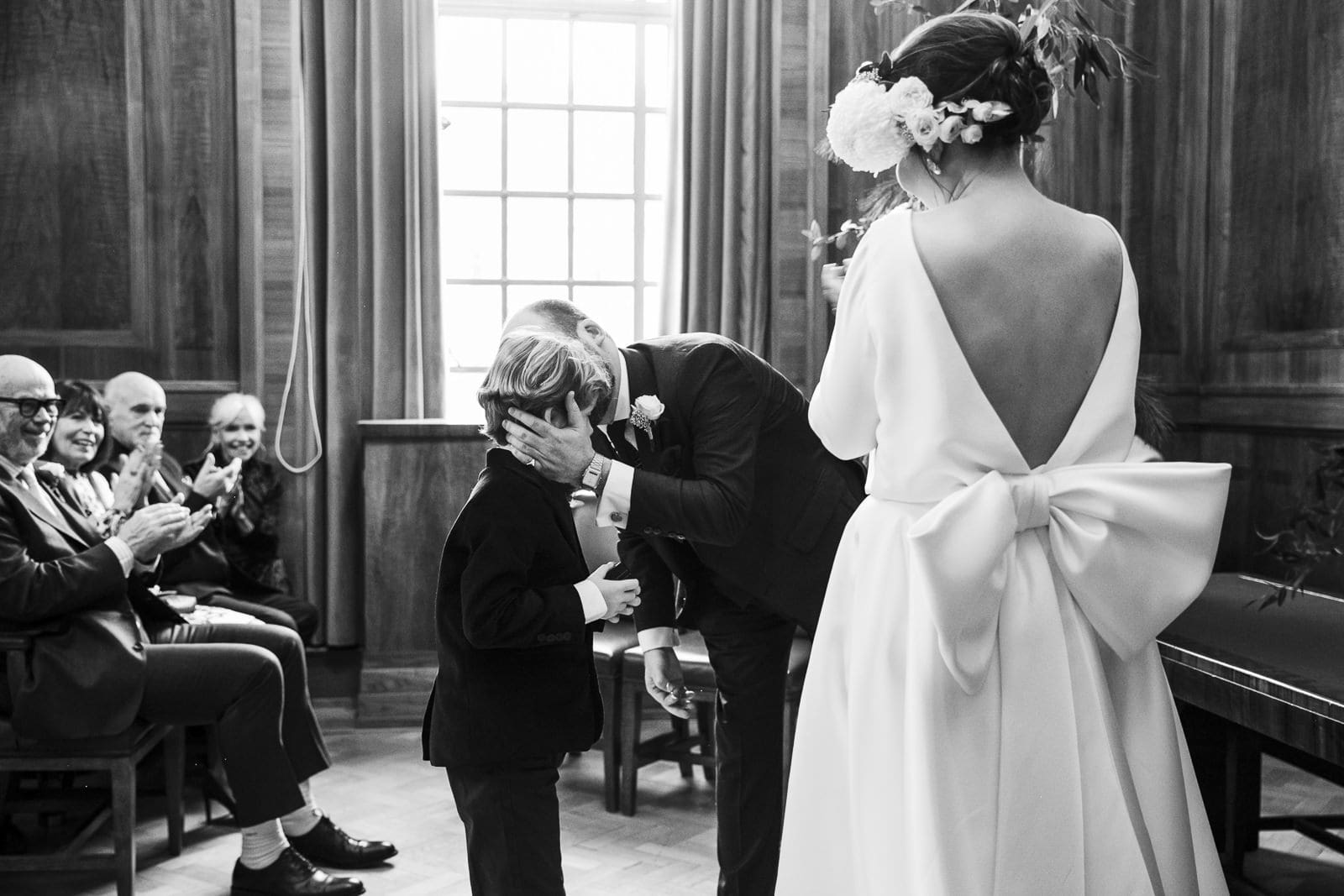 Will embracing a boy during the ceremony