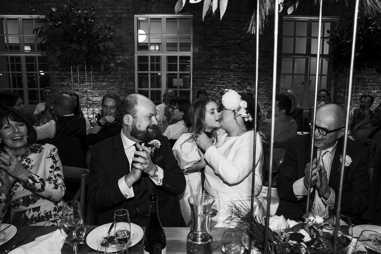 Jo and Will with family during their North Atrium wedding reception