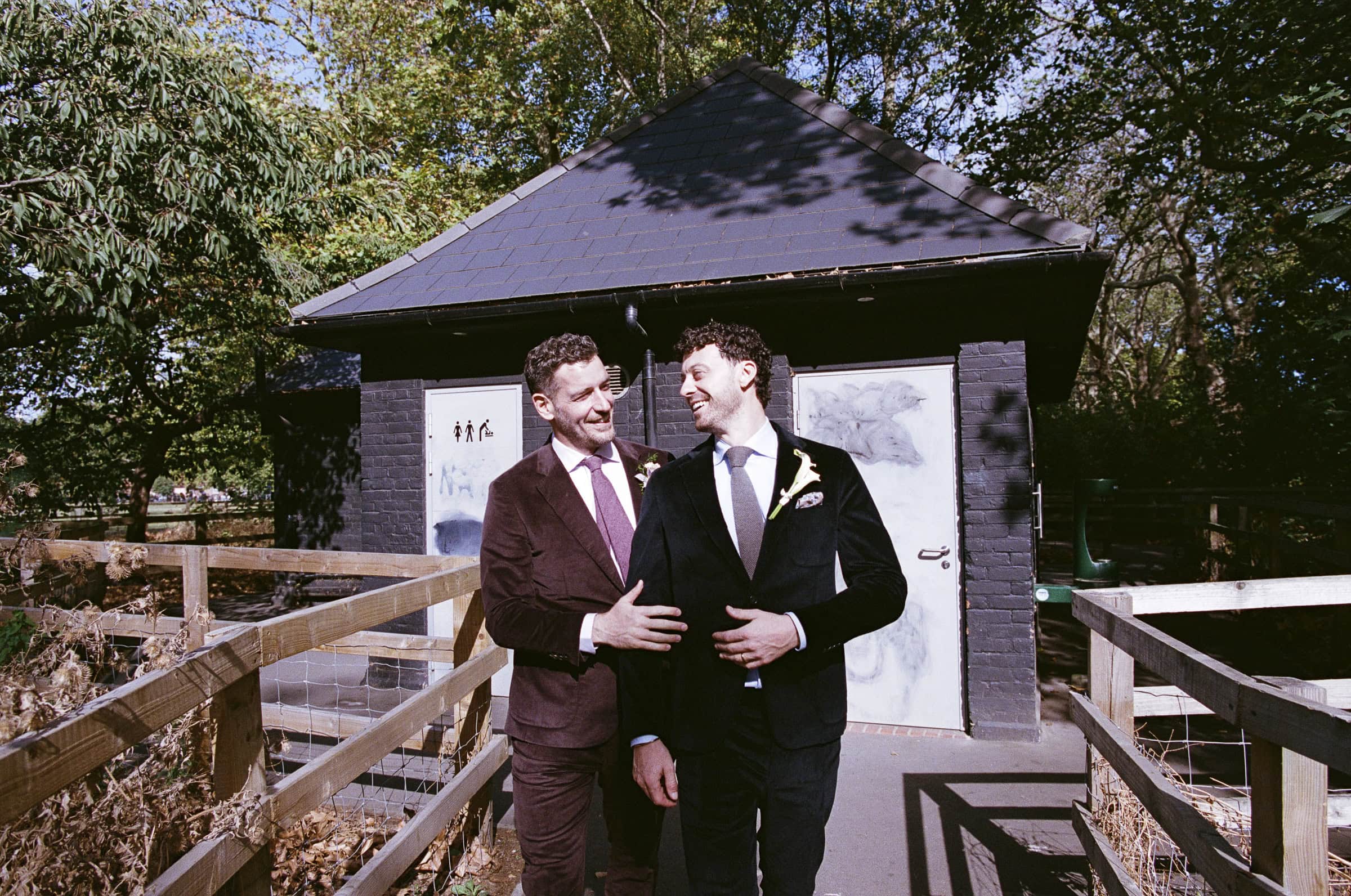 Ultan and Mitch laughing together beside the canal in Hackney